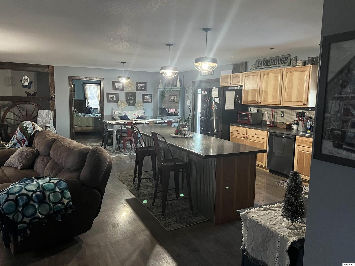 1126 East Co Road 350 Sutter, IL 62373 - Photo 3 of 23 a living room with couches and kitchen view