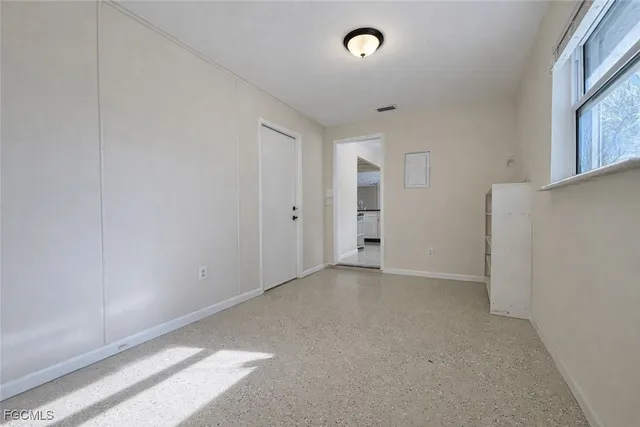 an empty room with windows