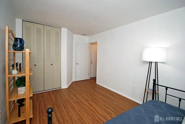 a view of a room with wooden floor and stairs
