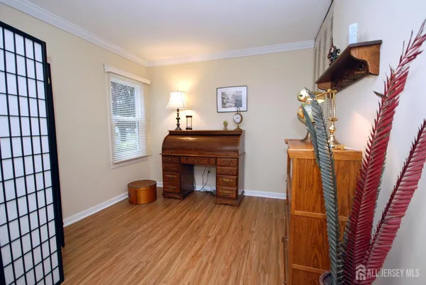 a view of a livingroom with furniture and wooden floor