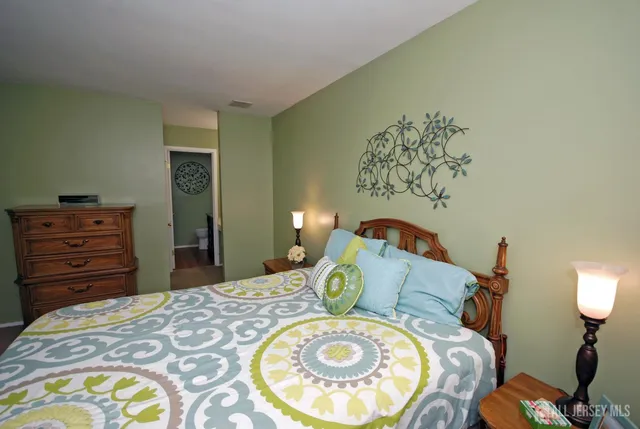 a bedroom with a bed and a tv