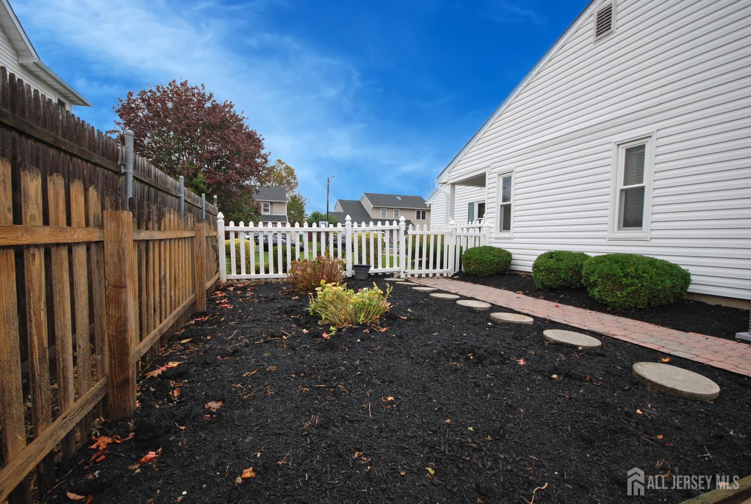 26 Sunshine Lane Edison, NJ 08820 - Photo 32 of 33 a view of a house with a street