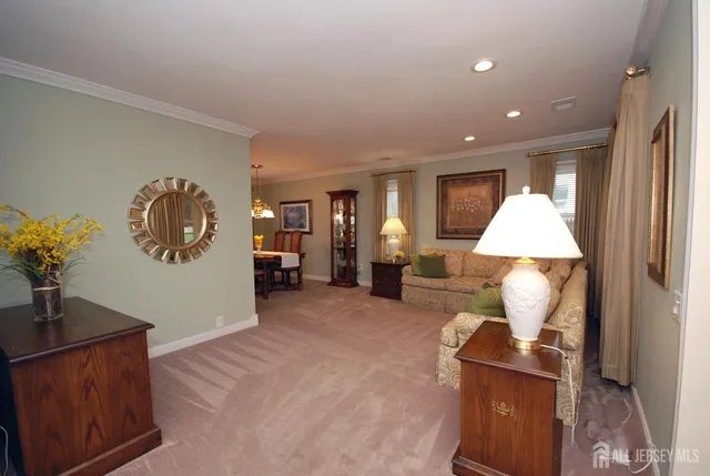 a living room with furniture and a lamp