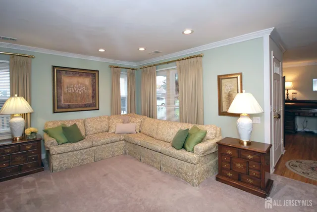 a living room with furniture and a lamp
