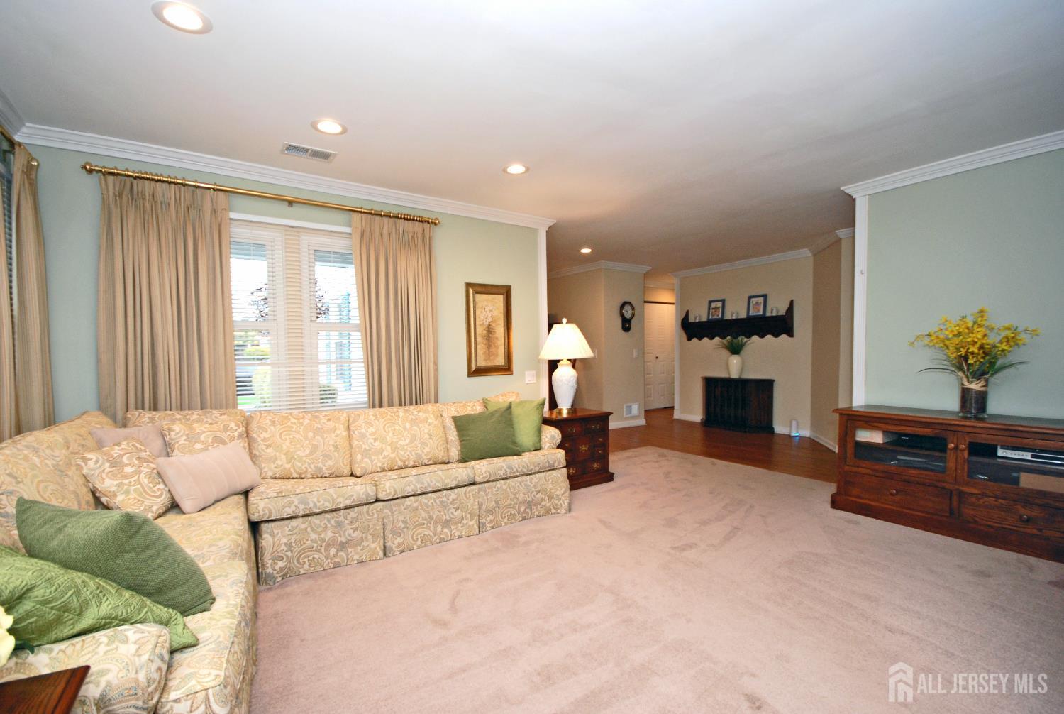 26 Sunshine Lane Edison, NJ 08820 - Photo 8 of 33 a living room with furniture and a fireplace