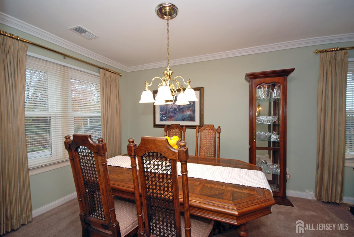 26 Sunshine Lane Edison, NJ 08820 - Photo 10 of 33 a dining room with furniture a chandelier and window