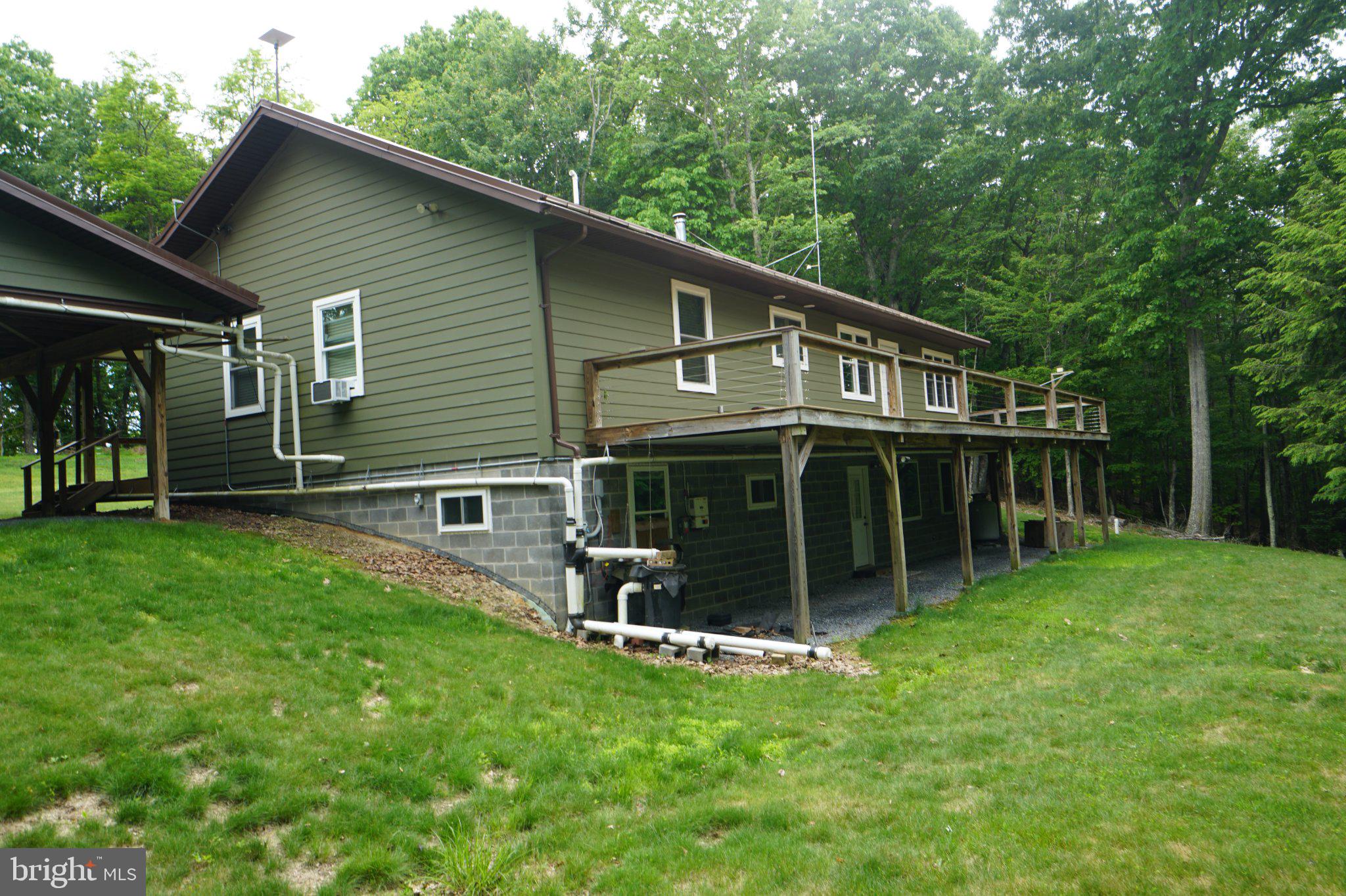 150 Sharp Ridge Lane Franklin, WV 26807 - Photo 10 of 69 Charming home nestled in lush greenery.