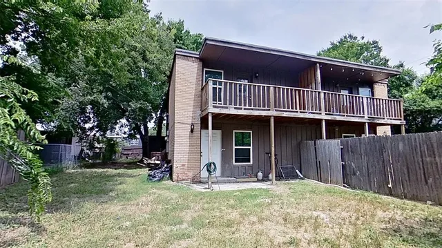 a view of a house with a porch and furniture