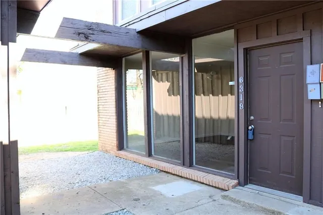 a view of a room that has a large window