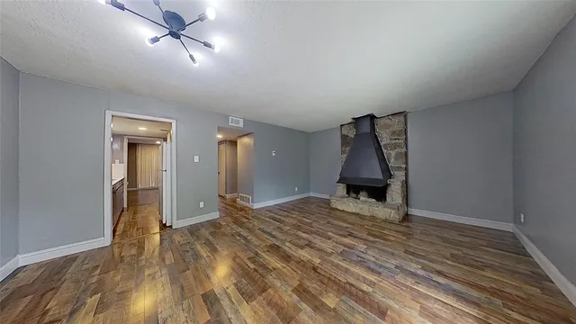 a view of a livingroom with wooden floor and closet