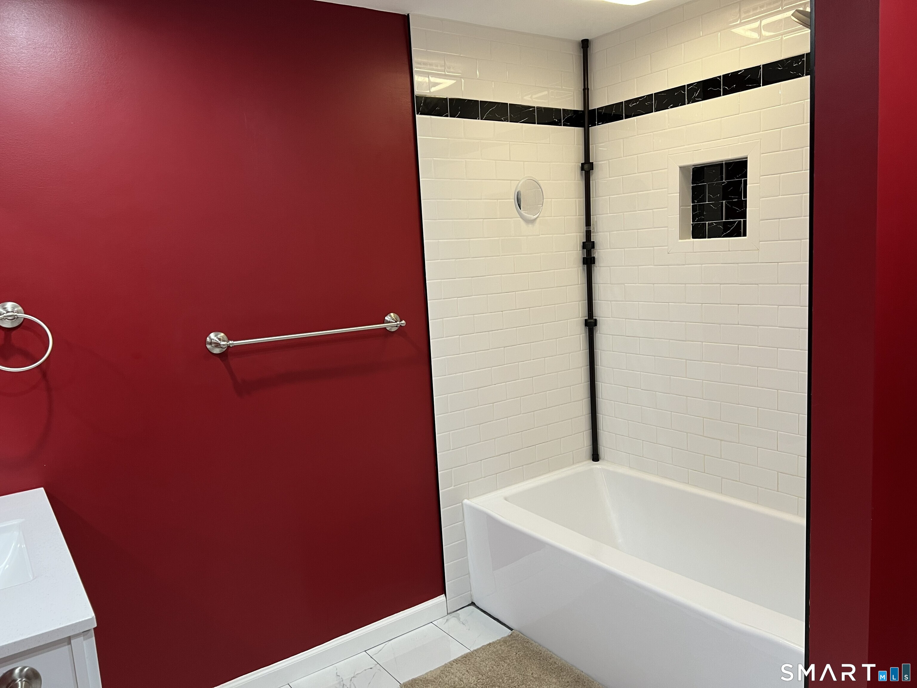 82 Bingham Street Bristol, CT 06010 - Photo 16 of 40 a bathroom with a shower and a bath tub
