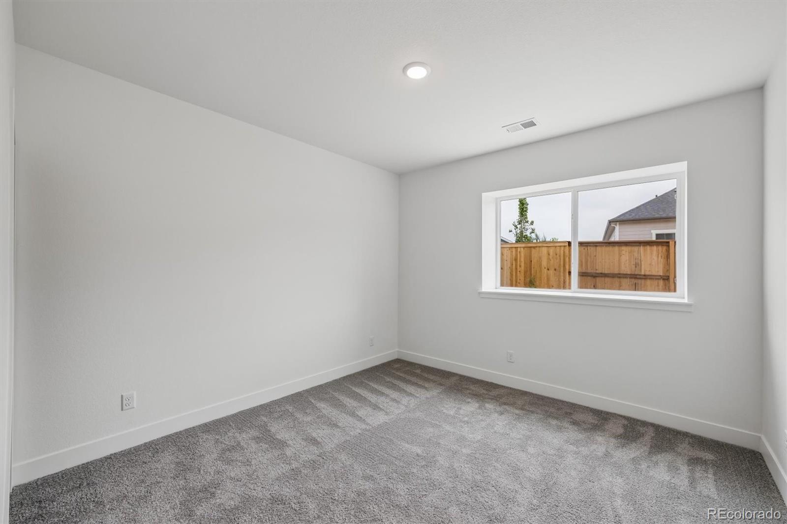 2516 West Bitterroot Place Highlands Ranch, CO 80129 - Photo 20 of 24 an empty room with a window