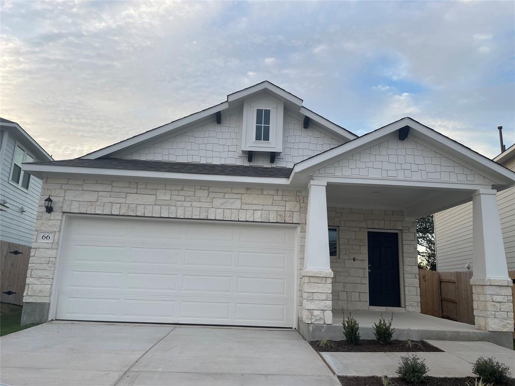 a front view of a house with a garage
