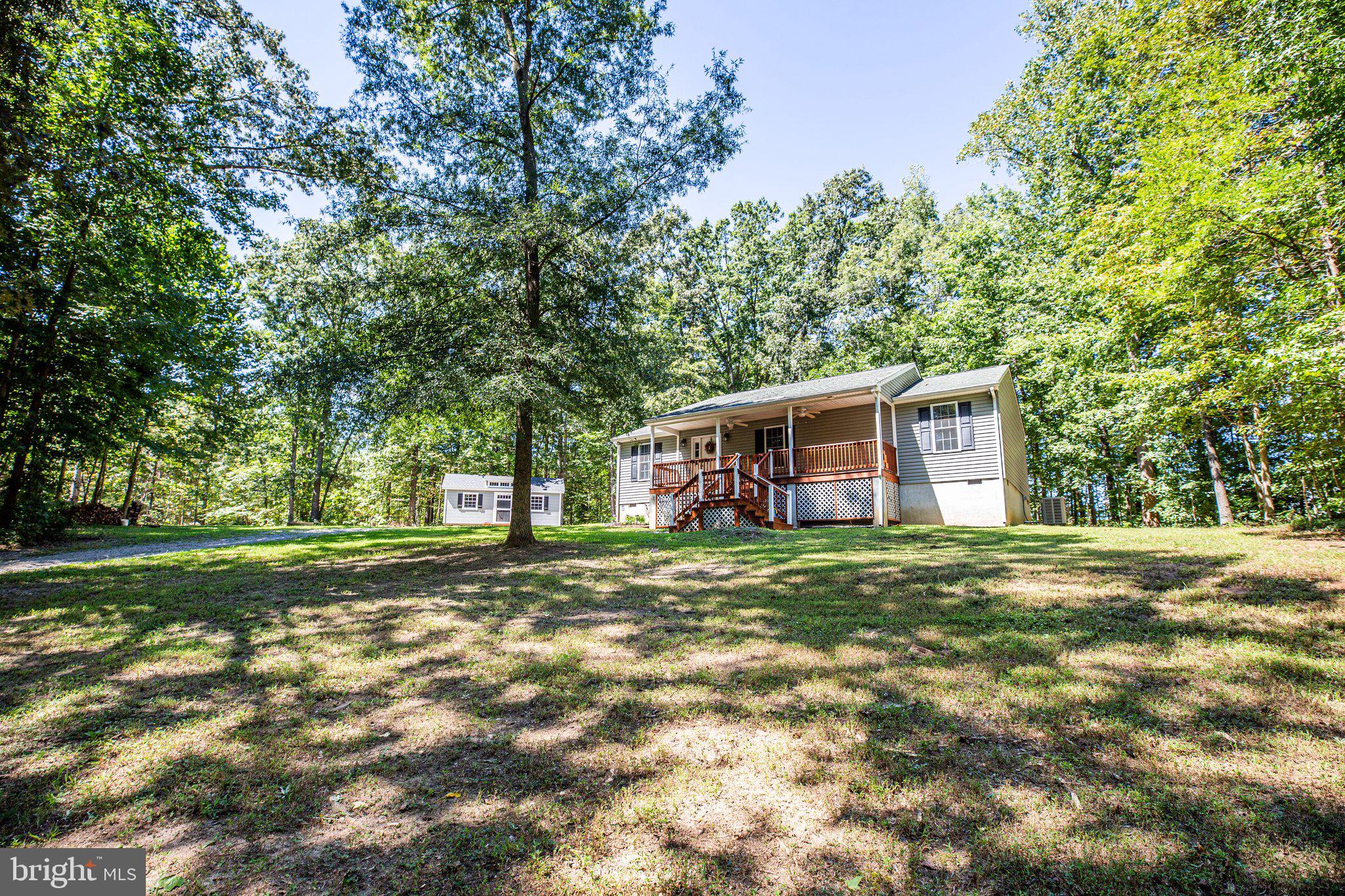 977 Fredericks Hall Road Bumpass, VA 23024 - Photo 3 of 38 Just enough shade to make outdoors more enjoyable