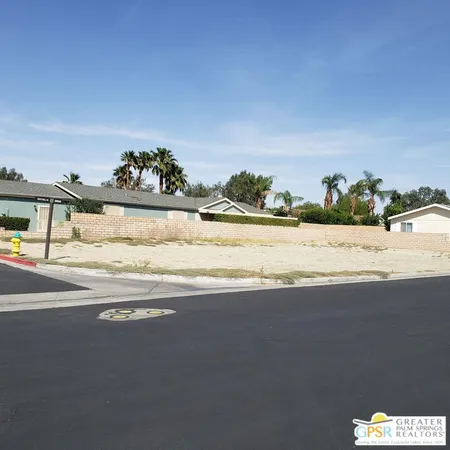 a view of a swimming pool and a yard