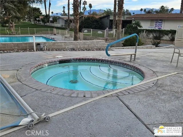 a view of a golf course with a lake view