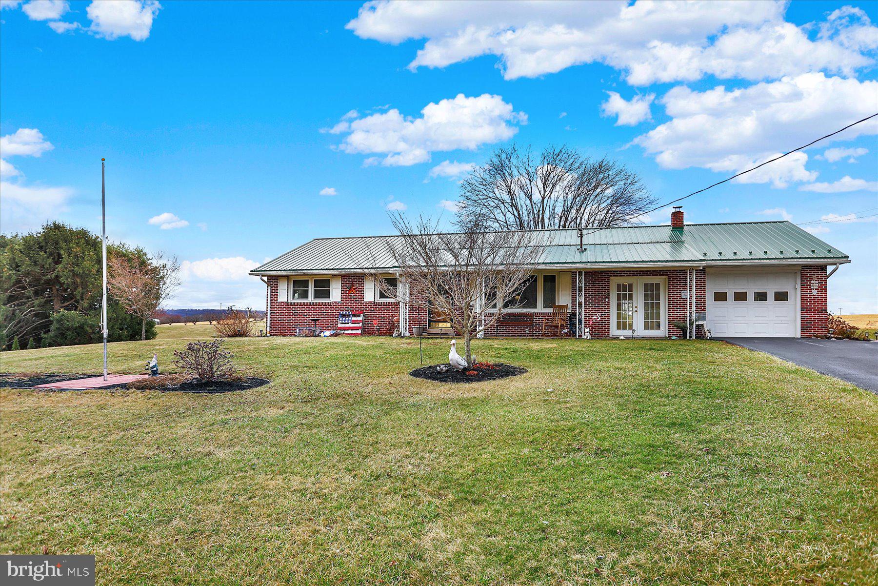 26 West Shortcut Road Newport, PA 17074 - Photo 1 of 37 a view of a house with a big yard and potted plants