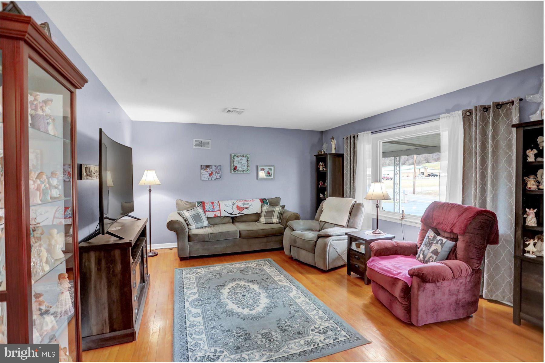 26 West Shortcut Road Newport, PA 17074 - Photo 4 of 37 a living room with furniture fireplace and a flat screen tv