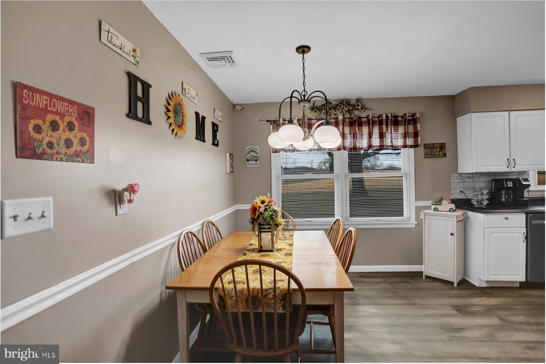 26 West Shortcut Road Newport, PA 17074 - Photo 6 of 37 a view of a dining room with furniture a chandelier and wooden floor