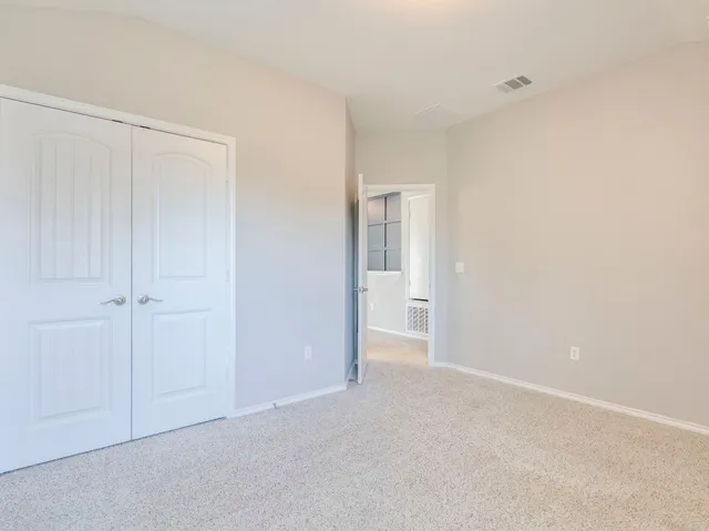 a bathroom with a bathtub shower sink vanity mirror and toilet