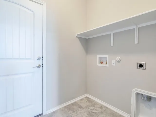 a view of a street with wooden fence