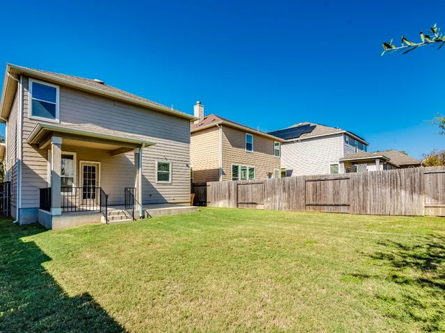 a house with swimming pool in front of it