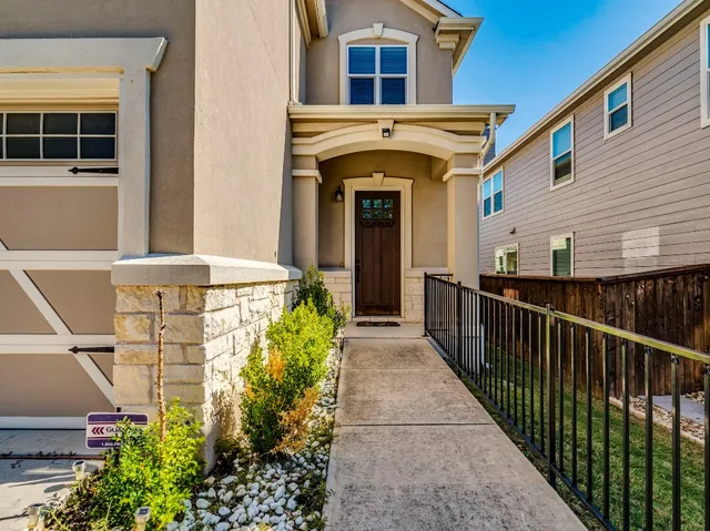 a view of a kitchen with wooden floor and a window