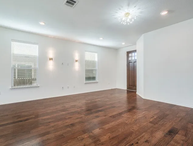 a kitchen with stainless steel appliances granite countertop a refrigerator stove top oven and sink