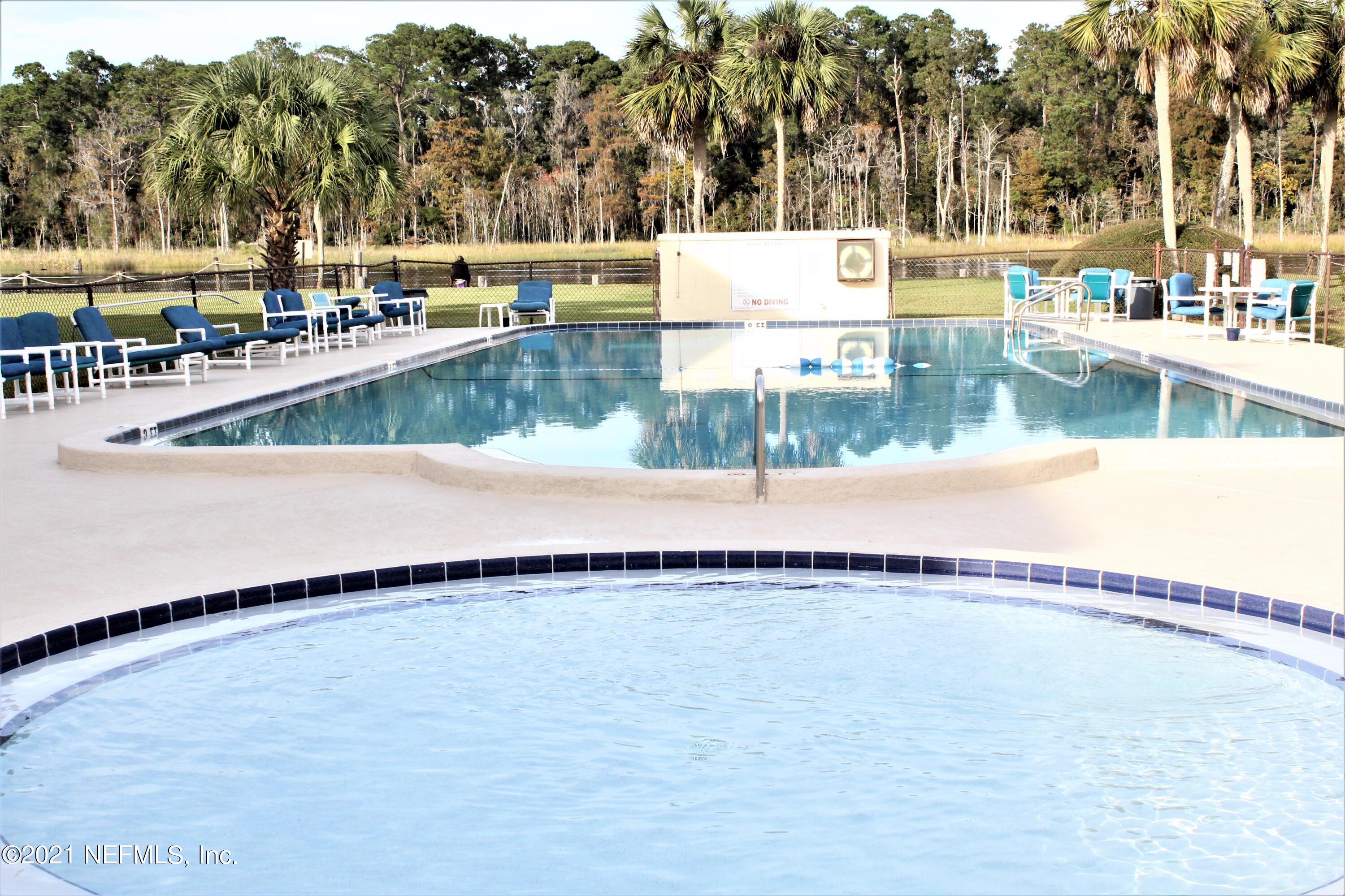 1557 El Prado Road, Unit 4 Jacksonville, FL 32216 - Photo 9 of 9 pool and lake_1(1)