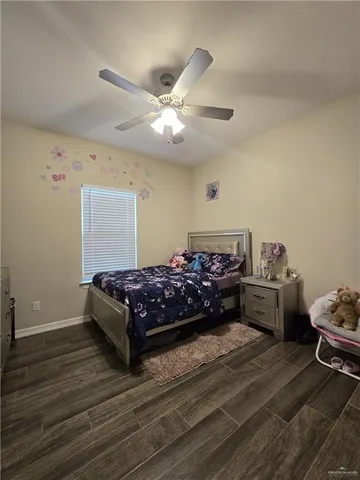 a bed room with a bed and a window