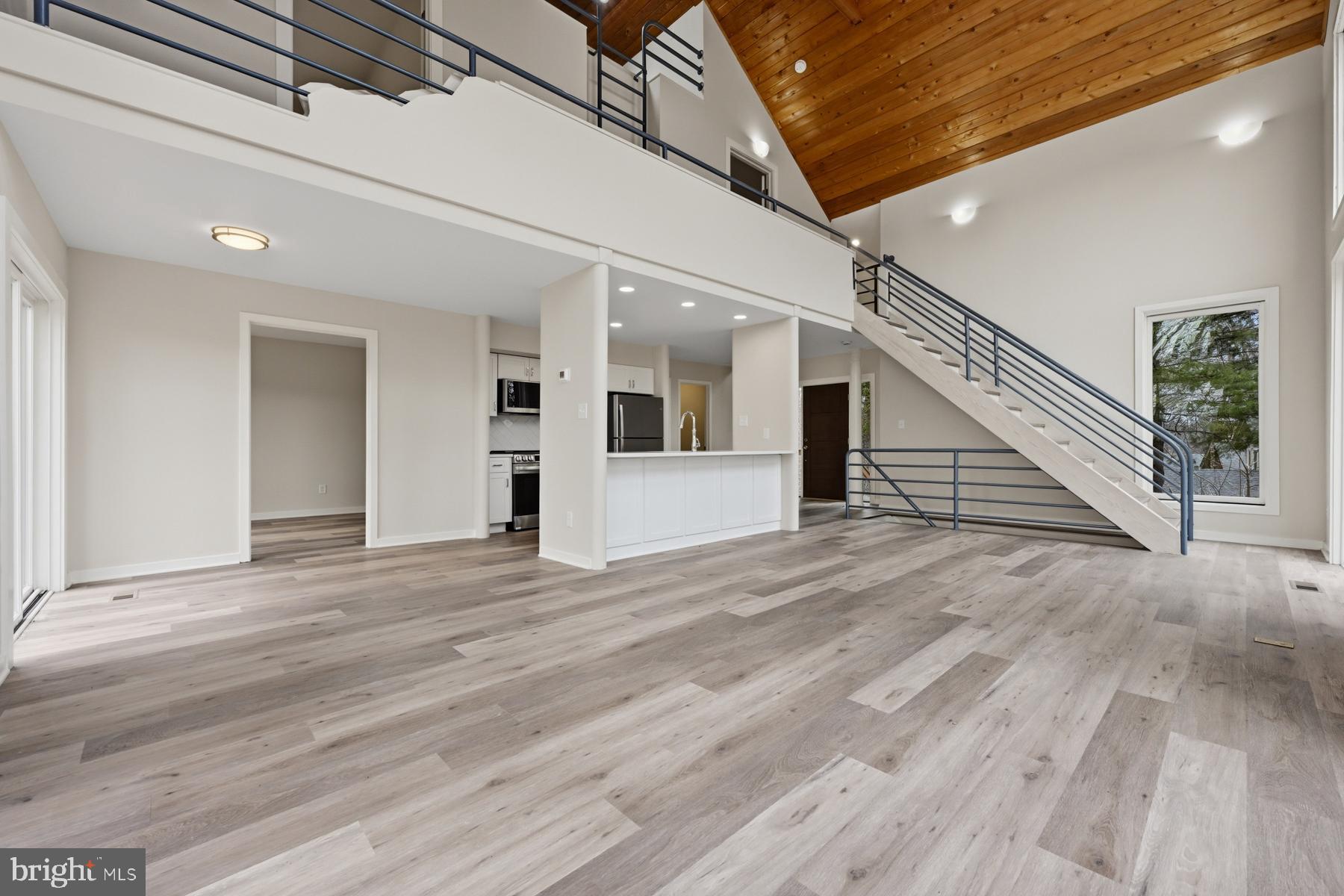 1717 Porters Hill Road Annapolis, MD 21401 - Photo 27 of 27 a view of a livingroom with wooden floor and stairs