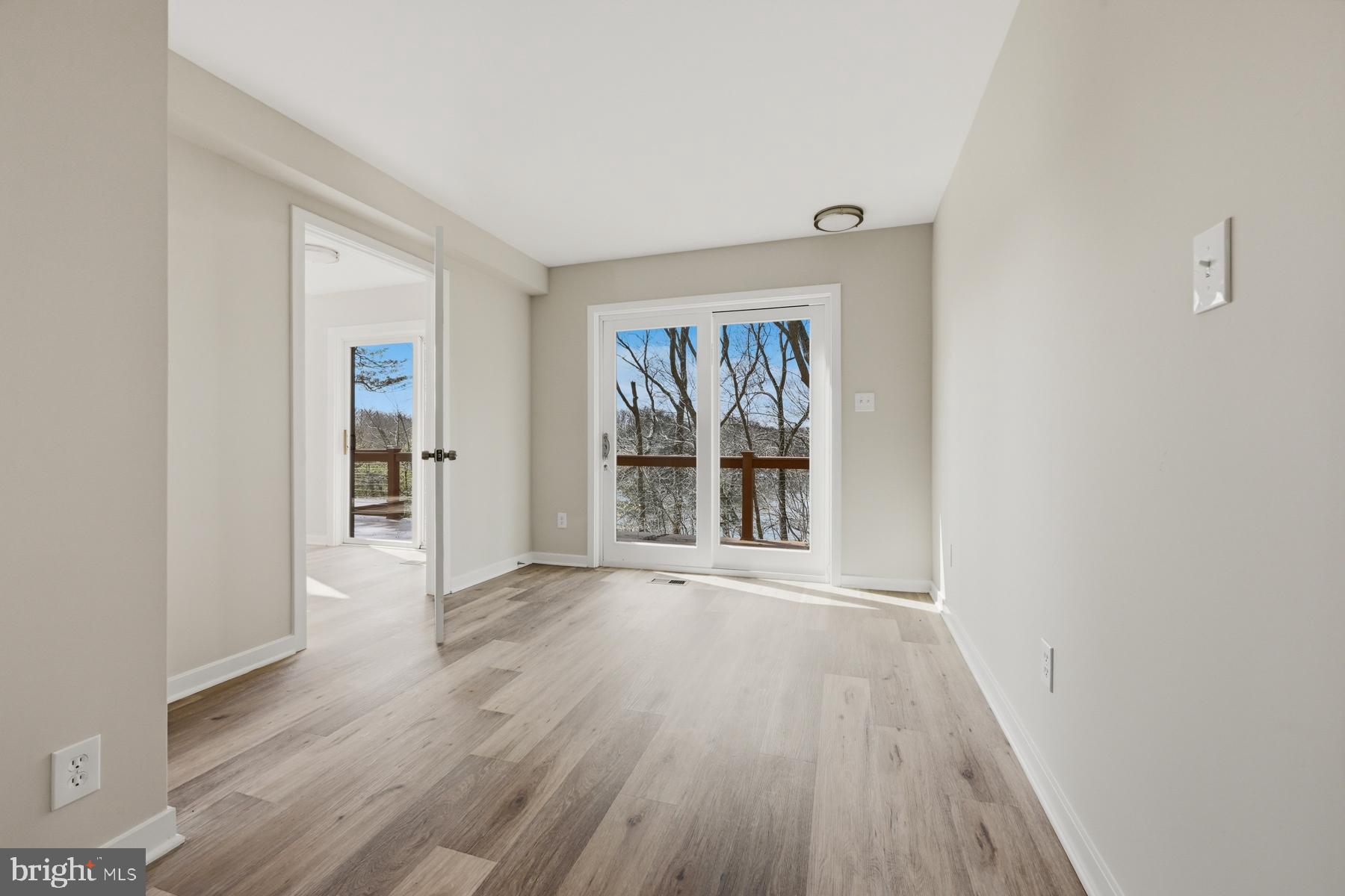 1717 Porters Hill Road Annapolis, MD 21401 - Photo 14 of 27 wooden floor in an empty room with a window