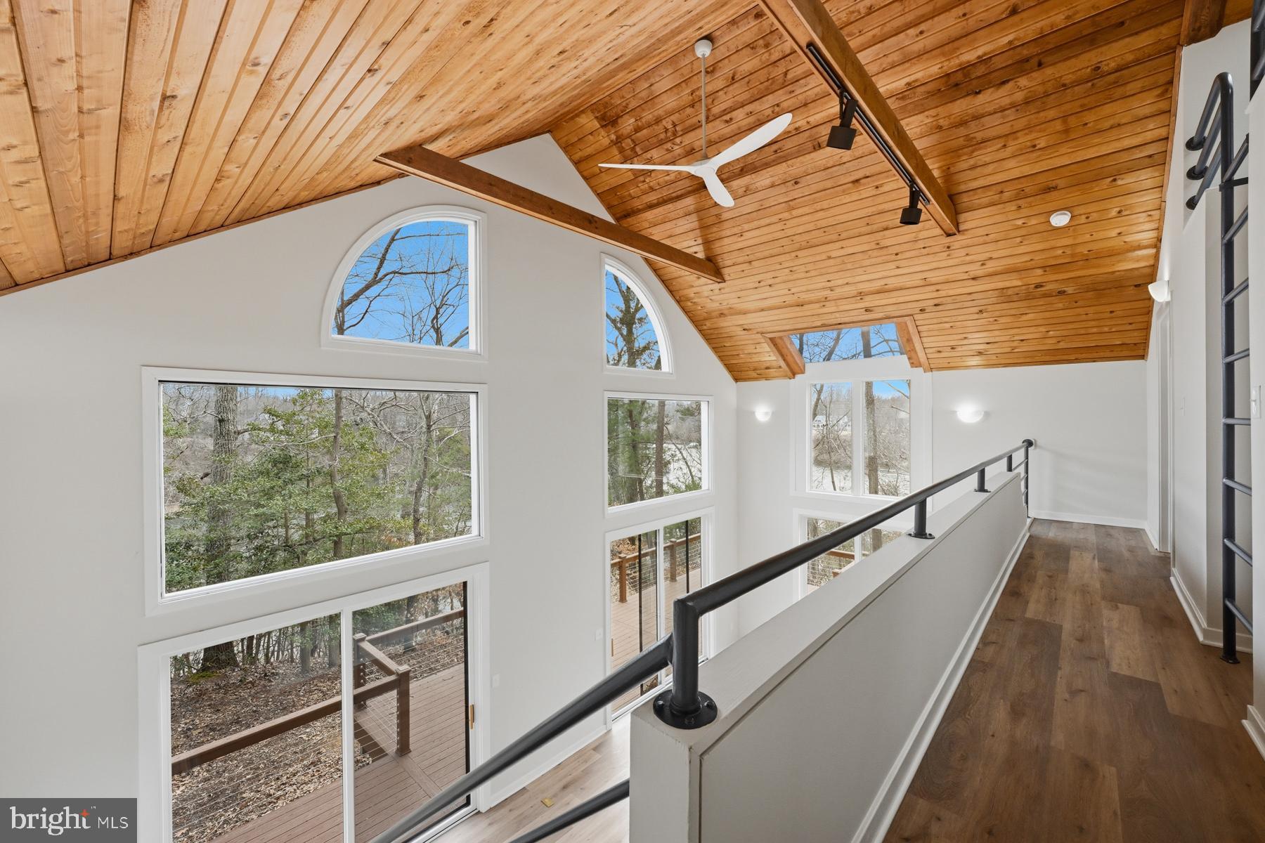 1717 Porters Hill Road Annapolis, MD 21401 - Photo 16 of 27 a view of balcony with wooden floor and stairs