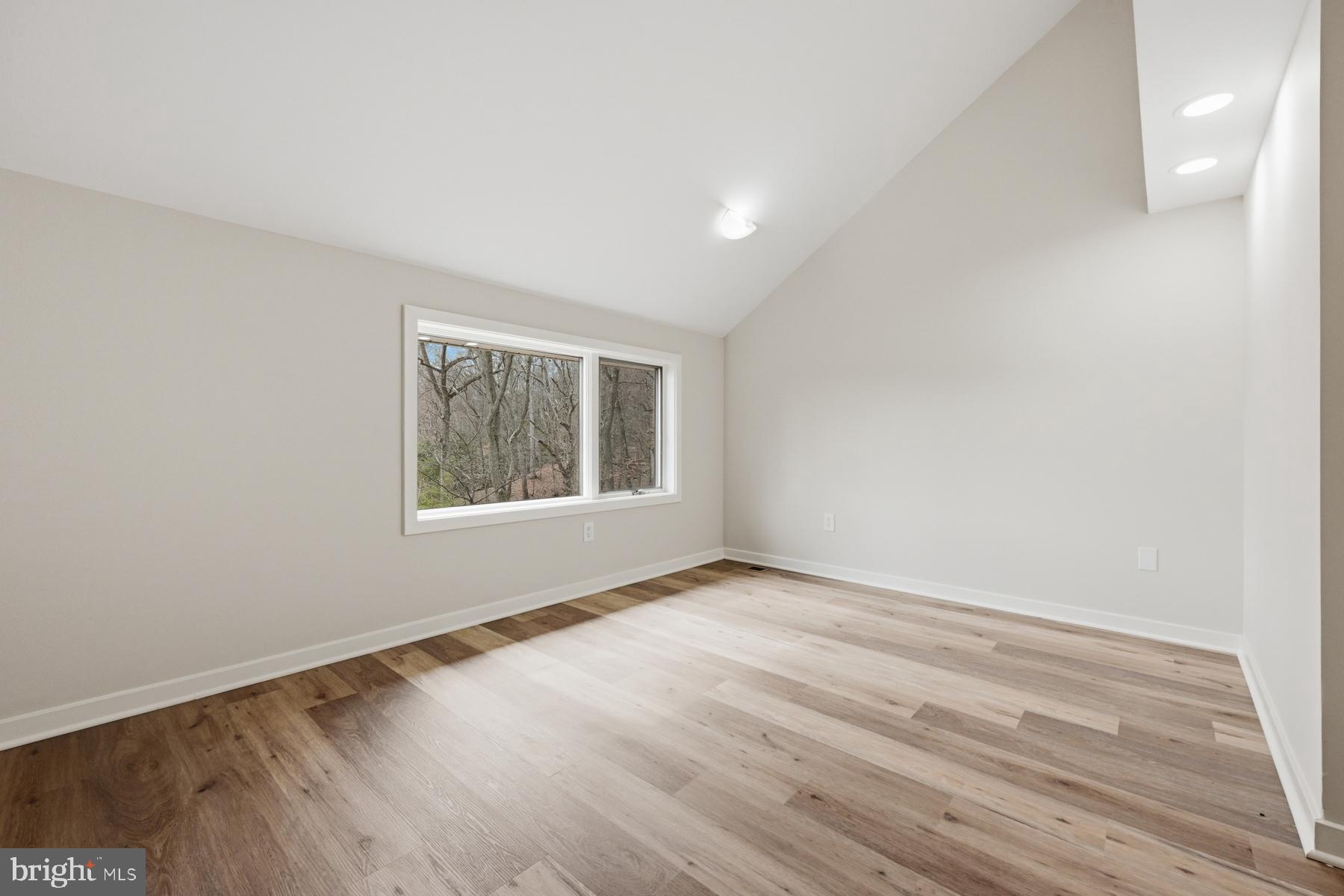 1717 Porters Hill Road Annapolis, MD 21401 - Photo 18 of 27 wooden floor in an empty room with a window