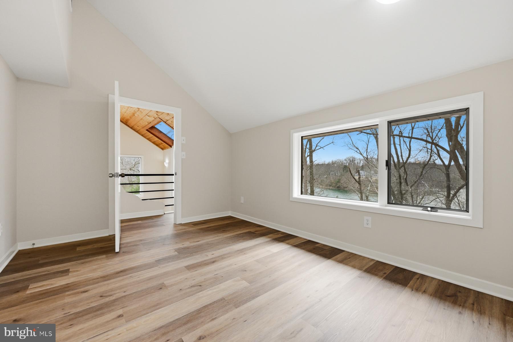 1717 Porters Hill Road Annapolis, MD 21401 - Photo 19 of 27 a view of empty room with window and wooden floor