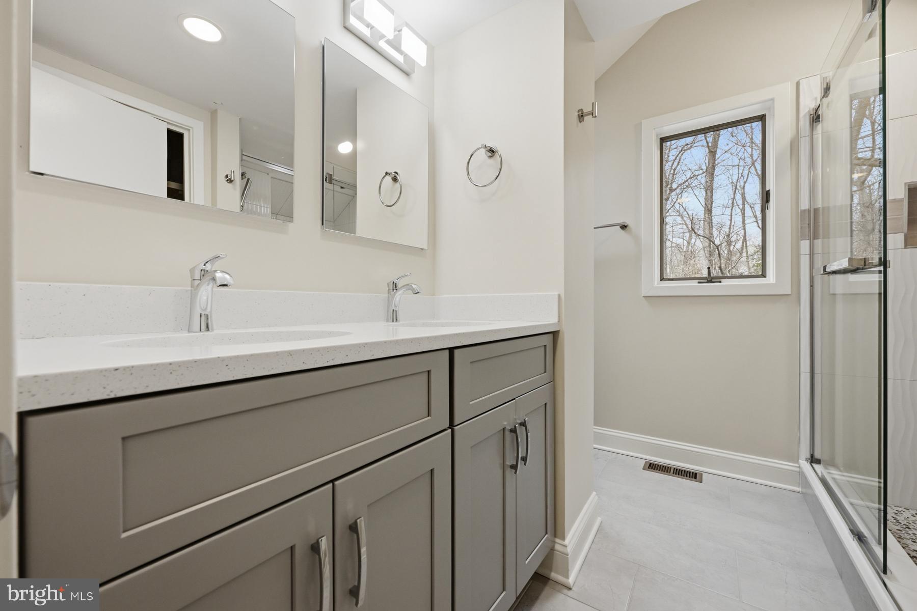 1717 Porters Hill Road Annapolis, MD 21401 - Photo 20 of 27 a bathroom with a sink and a mirror