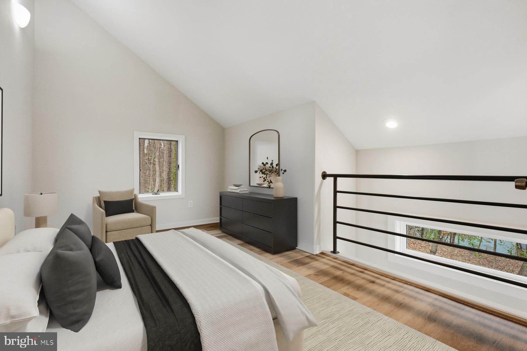 1717 Porters Hill Road Annapolis, MD 21401 - Photo 22 of 27 a bedroom with a bed and a painting on the wall