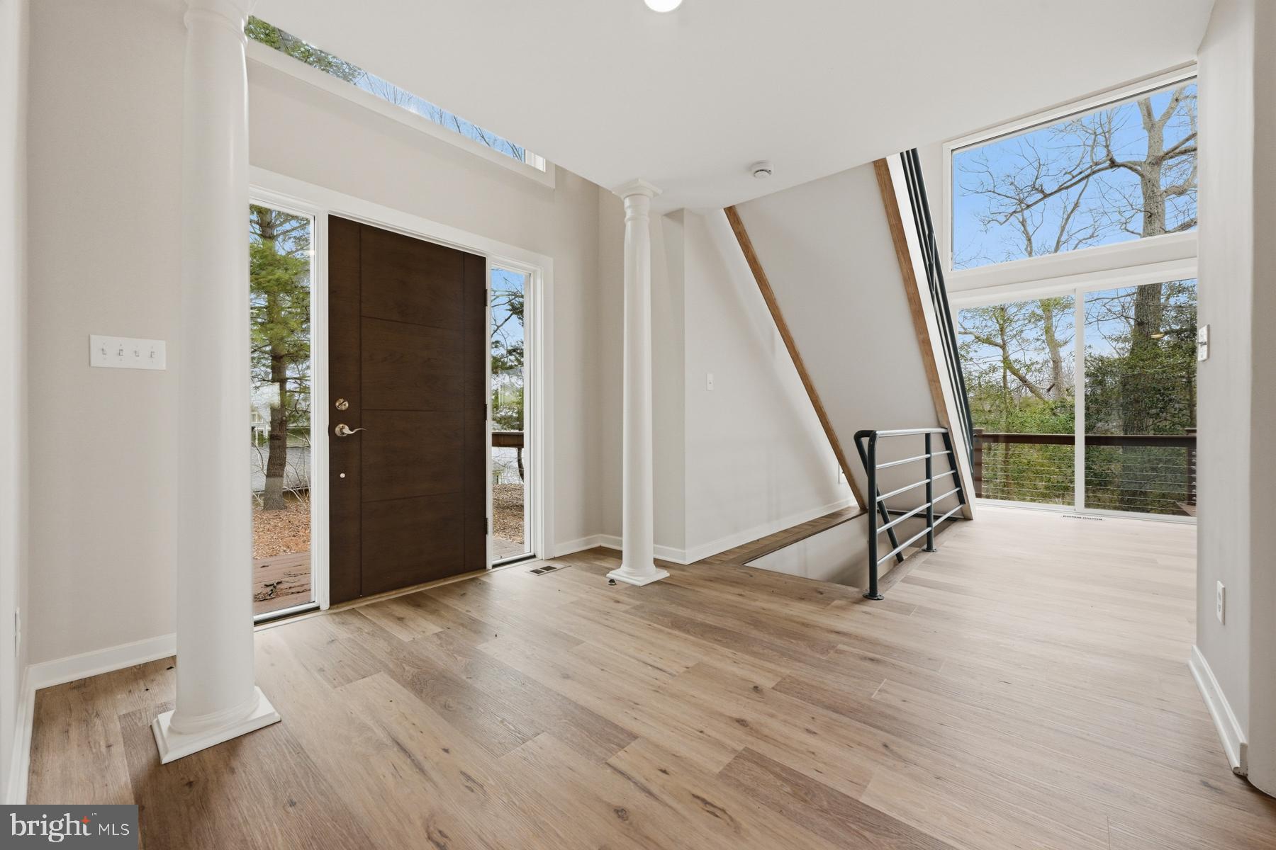 1717 Porters Hill Road Annapolis, MD 21401 - Photo 4 of 27 a view of an empty room with wooden floor and a window