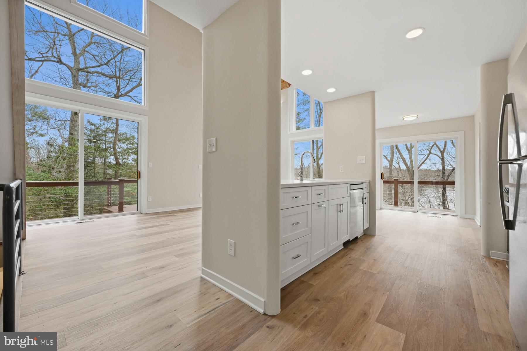 1717 Porters Hill Road Annapolis, MD 21401 - Photo 6 of 27 a view of a room with windows and wooden floor