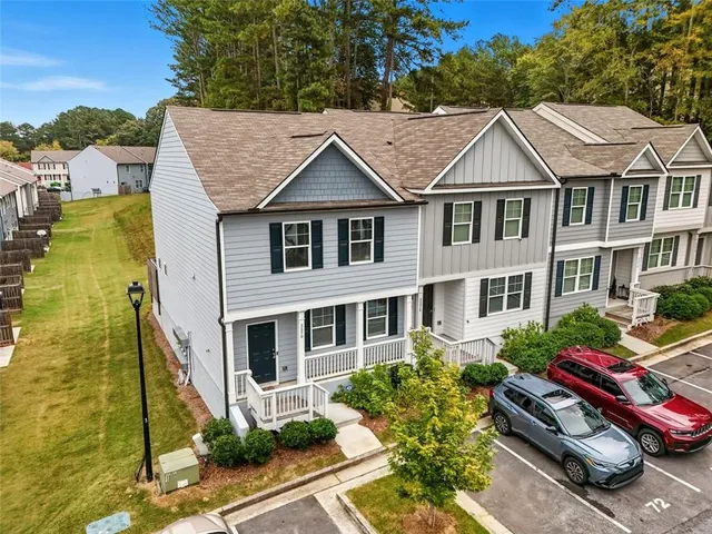 a view of multiple houses with a street