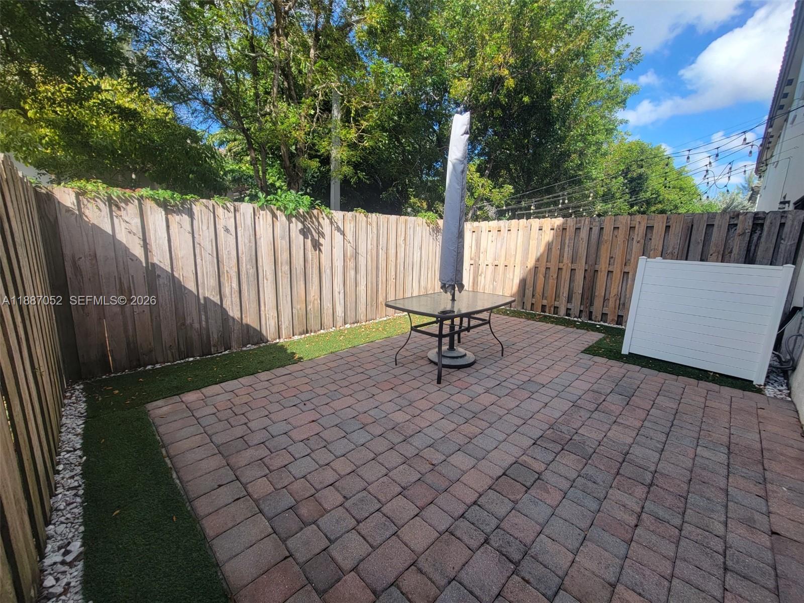 8860 Northwest 103rd Path Doral, FL 33178 - Photo 25 of 52 a view of outdoor space with wooden fence