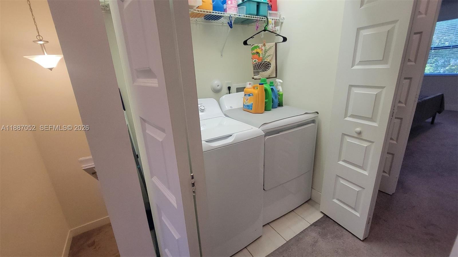 8860 Northwest 103rd Path Doral, FL 33178 - Photo 28 of 52 a utility room with dryer and washer