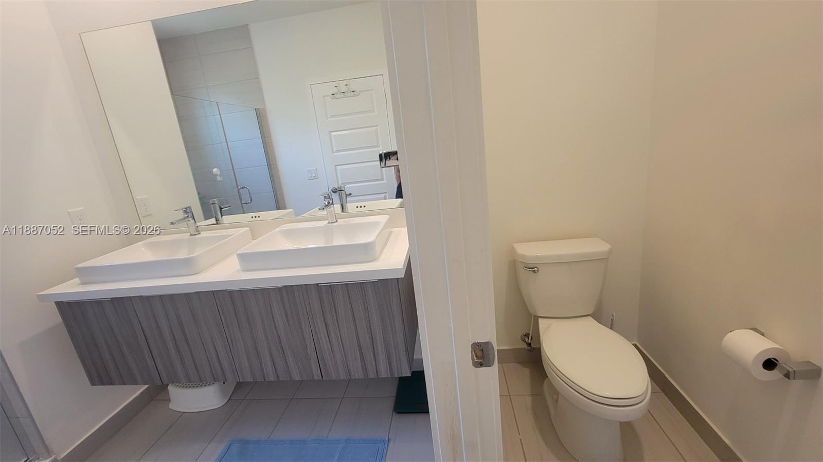 8860 Northwest 103rd Path Doral, FL 33178 - Photo 37 of 52 a bathroom with a sink and a toilet
