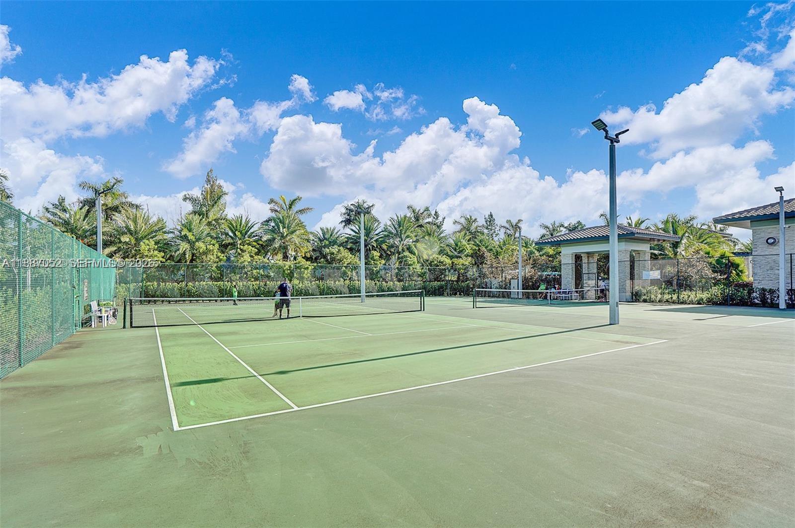 8860 Northwest 103rd Path Doral, FL 33178 - Photo 47 of 52 a view of a tennis court