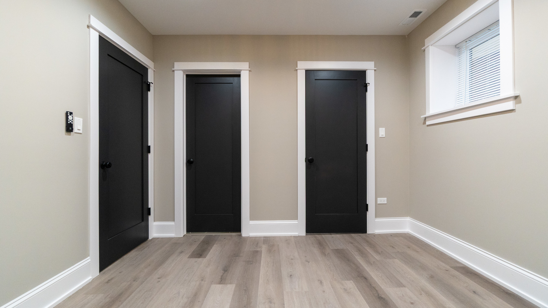 4745 North Beacon Street, Unit GS Chicago, IL 60640 - Photo 22 of 43 a view of an empty room with wooden floor and closet