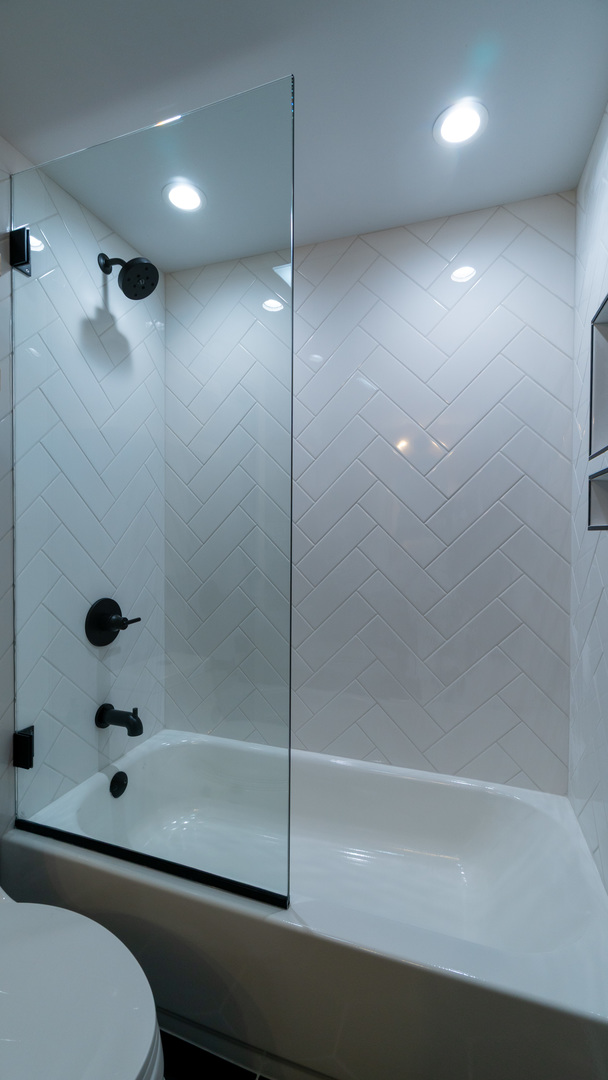 4745 North Beacon Street, Unit GS Chicago, IL 60640 - Photo 27 of 43 a bathroom with a shower and a toilet