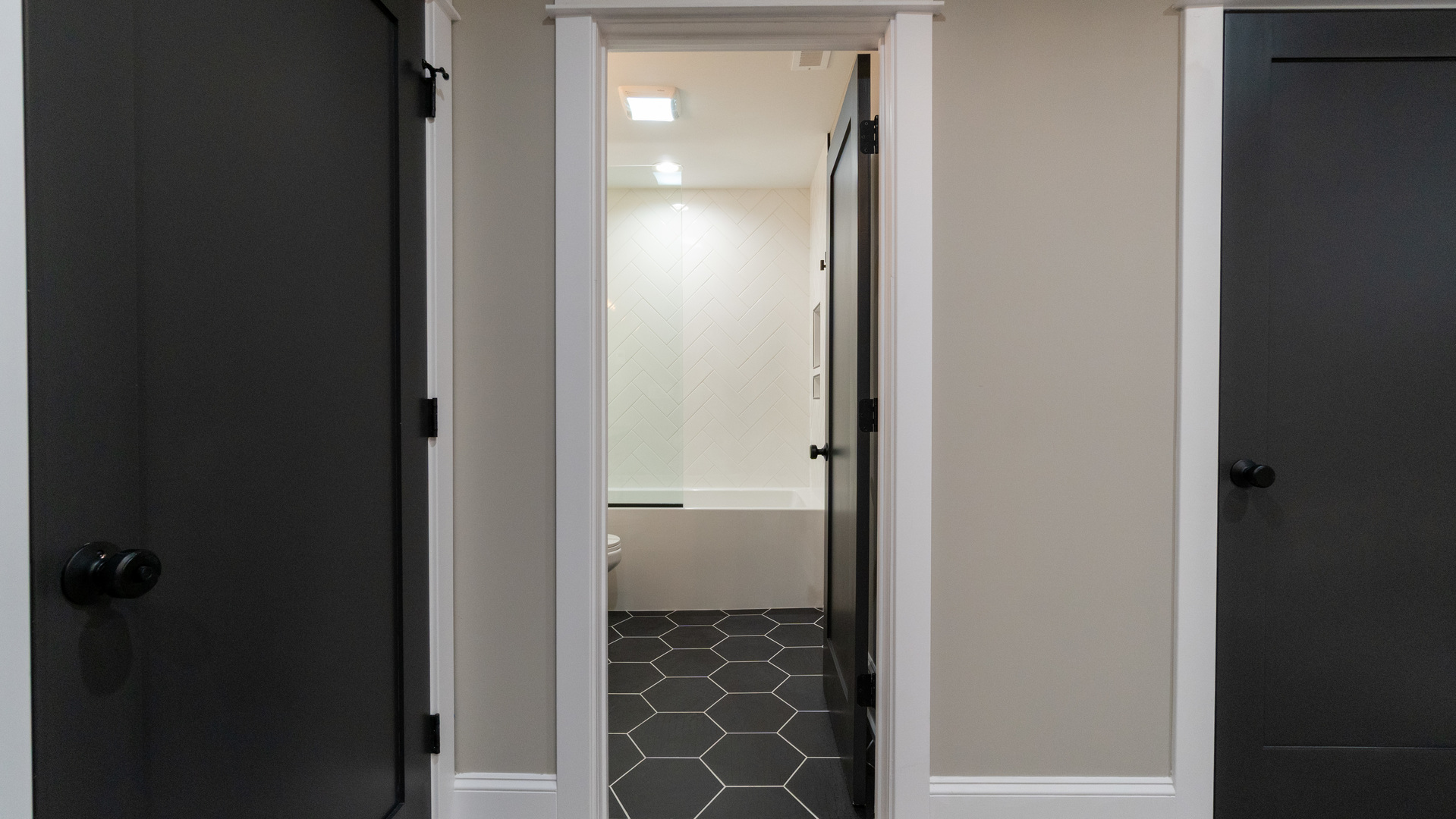 4745 North Beacon Street, Unit GS Chicago, IL 60640 - Photo 29 of 43 a bathroom with a bathtub and a shower