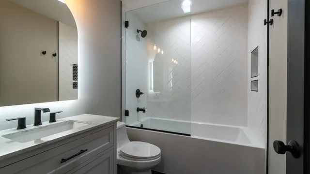 a bathroom with a sink vanity and a mirror
