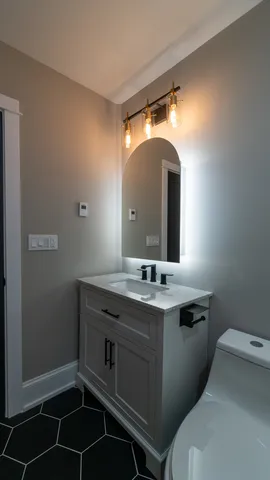 a bathroom with a sink and a mirror