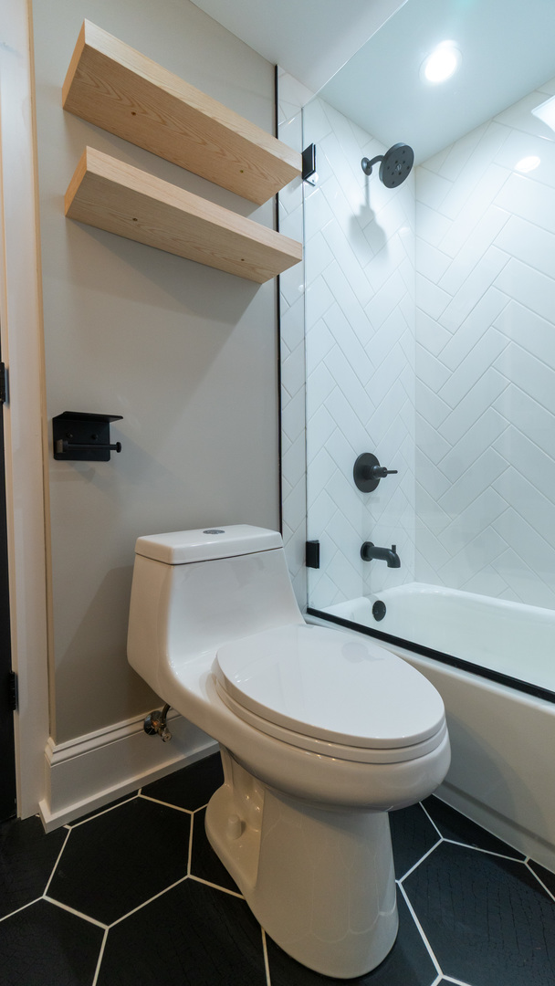 4745 North Beacon Street, Unit GS Chicago, IL 60640 - Photo 35 of 43 a bathroom with a sink toilet and shower